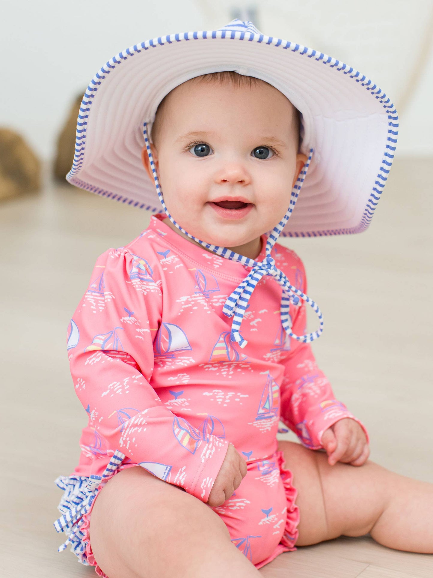 Seas the Day Long Sleeve One Piece Rash Guard Swimsuit with Signature Rear Ruffles