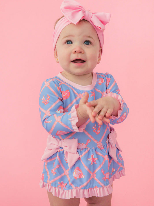 Tropical Trellis Long Sleeve One Piece Bow Peplum Rash Guard Swimsuit with Signature Rear Ruffles